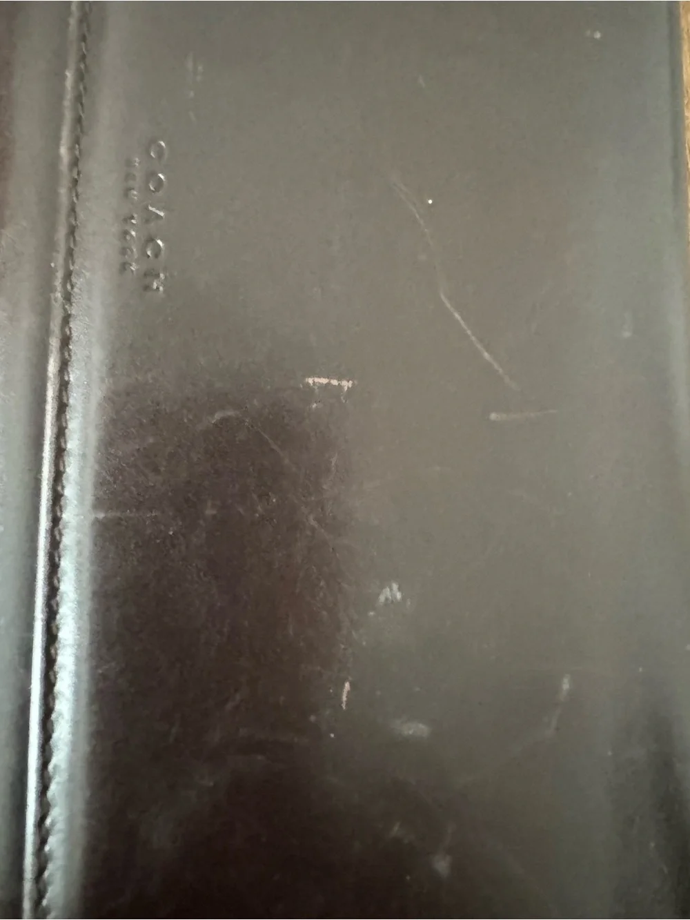 Dark Brown Coach Wallet with lots of card space, never used but has scratch